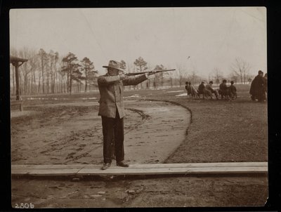 Frank Work Aiming a Rifle at a Trap Shoot, New York, 1896 by Byron Company